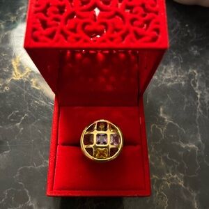 Elegant Gold Ring with Purple and Yellow Accents